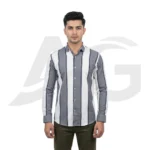 Front view of a man wearing a men's grey and white vertical broad striped long-sleeve button-down shirt