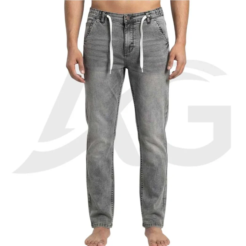 Front view of a man wearing men's grey drawstring jeans with a faded wash and white waist tie.