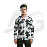 Front view of a man wearing a white long-sleeve button-down shirt featuring black abstract brushstrokes and scattered typography