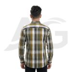 Back view of a man modeling an olive green and yellow checkered shirt, showing the shoulder yoke and curved hemline.