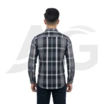 Back view of a man modeling a grey and black checkered men's shirt, highlighting the back yoke and structured shoulder fit.