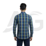 Back view of a man modeling a blue and green plaid shirt, highlighting the classic back yoke and structured shoulder fit.