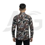Back view of a man modeling a dark brown and white abstract print shirt with typography, showing the continuous graphic pattern and shoulder fit.