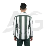 Back view of a man wearing a brown and black plaid long-sleeve shirt showing the shoulder yoke and curved hemline.
