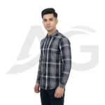 Left-facing side view of a man wearing a grey, black, and white checkered casual shirt.