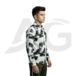 Right side profile view of a man wearing a white abstract letter print long-sleeve shirt, showcasing the tailored sleeve fit and curved hemline.