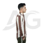 Right side profile of a male model wearing a brown and white striped long-sleeve casual shirt with a curved hem.