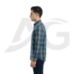 Left-facing side view of a man in a blue and green checkered casual shirt.