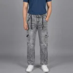 Male model wearing men's grey acid wash denim cargo pants featuring a front vertical seam, side utility pockets, and a black drawstring.
