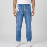 Male model wearing full-length regular fit blue denim cargo pants styled with a white shirt and white sneakers.