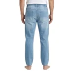 Back view of men's light blue denim joggers showcasing a comfortable elastic waistband and two rear patch pockets.