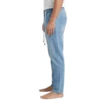 Side profile view of men's light blue denim drawstring jeans demonstrating a relaxed, straight-leg fit.