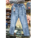 Men's light blue denim pants held up in a store, displaying the front leg seam, drawstring waist, and light wash texture.