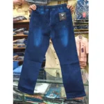 Dark wash front-seam denim pants held up in a shop, highlighting the deep blue color and front seam construction.