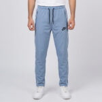 Light blue Nike trousers for men in Pakistan with white side piping, zipper pockets, and adjustable drawstring waist.