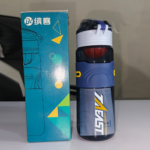 Navy blue travel water bottle 720ml with orange flip-lock lid and side clips