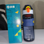 Navy blue travel water bottle 720ml with orange flip-lock lid and side clips