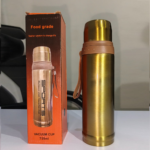 Gold stainless steel insulated thermos 750ml with tan carry strap