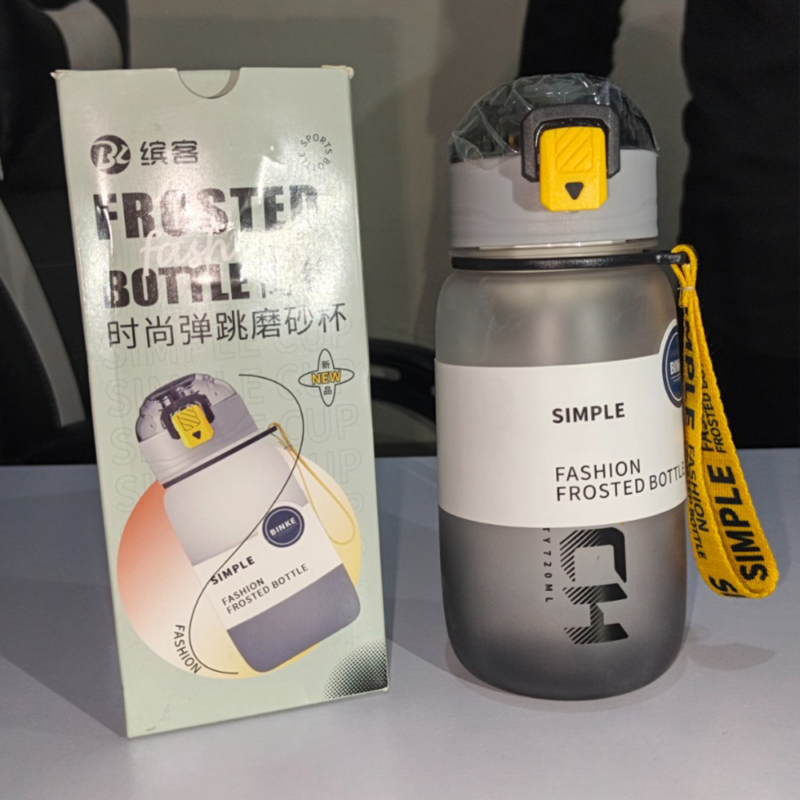 Grey frosted 720ml sports water bottle with pop-up straw lid and yellow strap